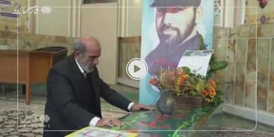 خبرگزاری فارس - فیلم| سربند «ما مرد جنگیم» سوغاتی پدر  به پسر شهیدش