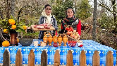 فیلم/ مهارت دیدنی دو بانوی روستایی گیلانی در طبخ غذای محلی با گوشت و بادمجان