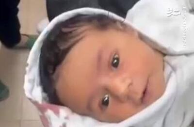 فیلم/ نجات یک نوزاد از خانه‌ای که در اردوگاه نصیرات