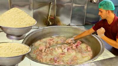 (ویدئو) فرآیند پخت 100 کیلو قابلی پلو با گوشت به روش تماشایی یک آشپز پاکستانی