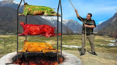 آشپز مشهور آذربایجانی ، سه بره 25 کیلوگرمی را در تنور زیرزمینی می پزد (فیلم)
