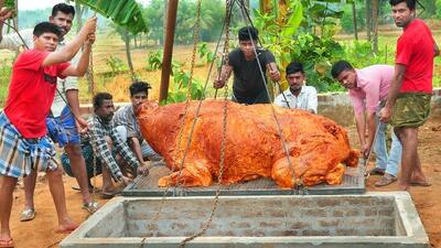 نحوه کباب کردن گاو 300 کیلویی در تنور به روش هندی ها (فیلم)