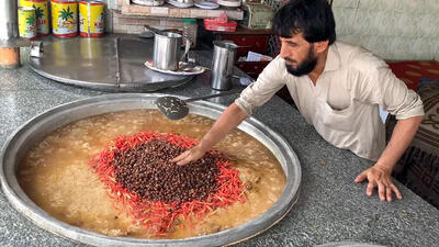 (ویدئو) غذای خیابانی در پاکستان؛ نحوه پخت 90 کیلو قابلی پلو با گوشت در کراچی
