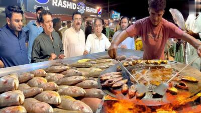 غذای خیابانی در پاکستان؛ ماهی سرخ شده و کبابی به سبک بنگلادشی در کراچی (فیلم)