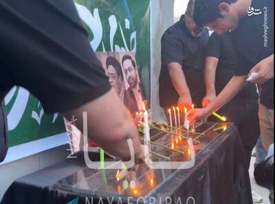 فیلم/ روشن کردن شمع به یاد شهید آیت الله رئیسی در بغداد