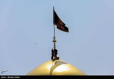 تعویض پرچم حرم امام رضا(ع)- عکس خبری تسنیم | Tasnim