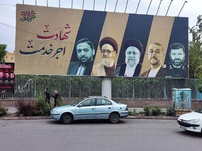 نصب تصاویر شهدای خدمت در دیوار نگاره‌های تبریز