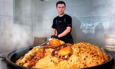 غذای خیابانی در ازبکستان؛ پخت 150 کیلو پلو ازبکی با گوشت (فیلم)