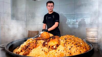(ویدئو) غذای خیابانی در ازبکستان؛ پخت 150 کیلو پلو ازبکی با گوشت