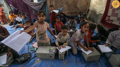 (تصاویر) آموزش زبان انگلیسی به کودکان جنگ‌زده غزه