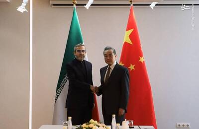 عکس/ دیدار باقری با وزیر خارجه چین