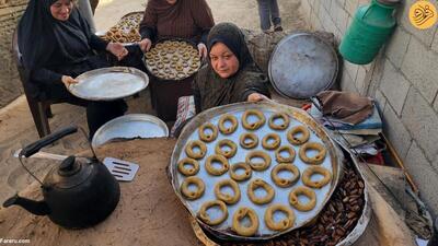 (تصاویر) کیک پزی زنان آواره فلسطینی بر روی ویرانه‌ها