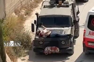 استفاده اشغالگران از فلسطینیان به عنوان سپر انسانی؛ نظامیان صهیونیست مجروح فلسطینی را به خودروی نظامی بستند