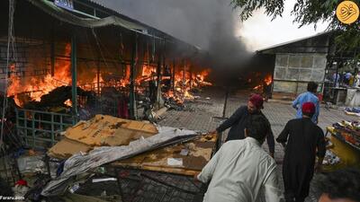 (تصاویر) آتش‌سوزی مهیب در بازاری در اسلام آباد