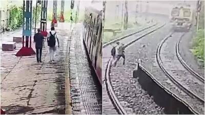 ببینید | لحظه بسیار دلخراش خودکشی پدر و پسر هندی روی ریل قطار / حاوی تصاویر ناراحت‌کننده