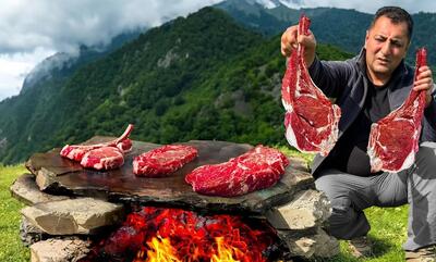 روش دیدنی آشپز آذربایجانی برای پخت متفاوت گوشت گاو روی سنگ داغ (فیلم)