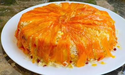 طرز تهیه هویج‌پلو مجلسی با ته‌دیگ هویج؛ مرحله به مرحله + نکات