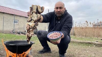 غذای روستایی در روسیه؛ پخت سوپ قفقازی با گوشت بره خشک شده (فیلم)