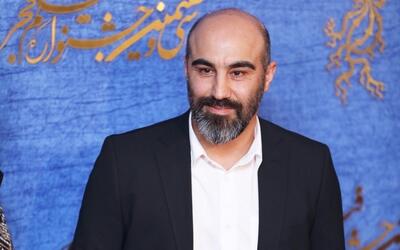 محسن تنابنده ۶ ساله در آغوش پدرش سال ۱۳۶۰+ عکس