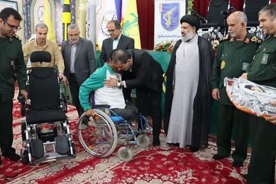 بسیج سازندگی بوشهر ۴۸ دستگاه ویلچر برقی به معلولان اهدا کرد