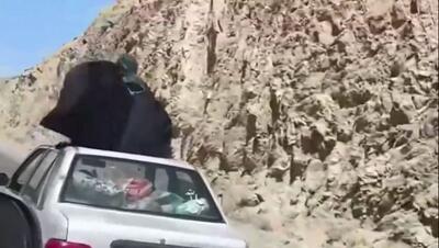 تصویر خطرناک از زنی که روی سقف پراید در حال حرکت نشسته بود (فیلم)