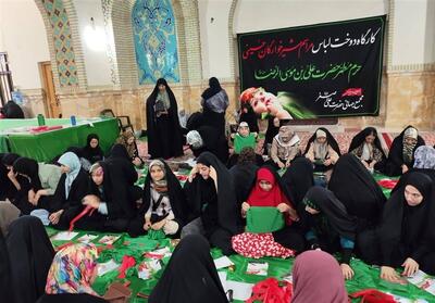 دوخت 13 هزار لباس شیرخوارگان حسینی در حرم رضوی - تسنیم