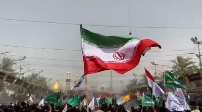 احتزاز پرچم ایران در عزاداری که صدام حسین ممنوع کرد