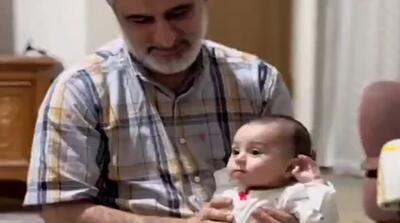 تصاویر متفاوت شهید سردار حاجی‌زاده با نوه‌اش