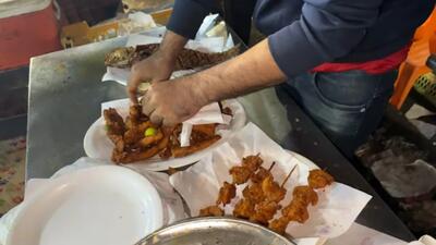 غذای خیابانی پاکستان؛ ماهی تازه کبابی در ساحل کراچی (فیلم)