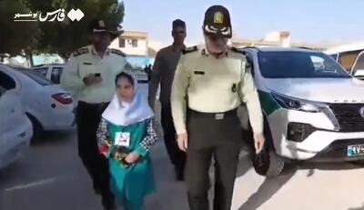 بدرقه دختر شهید مدافع امنیت تا مدرسه توسط فرمانده انتظامی استان بوشهر