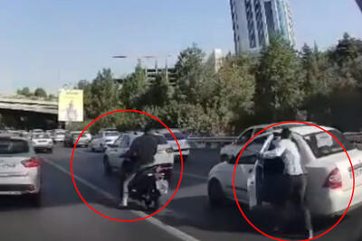 ببینید | لحظه سرقت گوشی در ترافیک اتوبان همت روبه‌روی برج میلاد