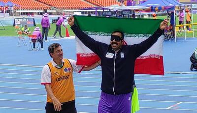 قهرمان جهان مدالش را به سردار حاجی‌زاده تقدیم کرد