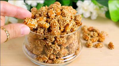 با این روش ساده بادام زمینی را به میان وعده ای ترد و اعتیاد آور تبدیل کن
