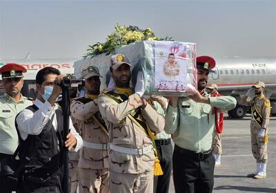  استقبال از پیکر مطهر شهید مرزبانی «سجاد صیامی» در فرودگاه مشهد تصاویر - تسنیم