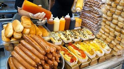  طرز تهیه محبوب‌ترین هات داگ با سس‌های متنوع در سئول (فیلم)