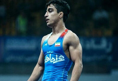  به کشتی‌گیر ملی‌پوش ایران یک زمین و یک باغ پاداش دادند