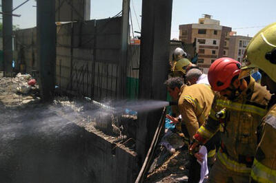  سقوط دو کارگر در آتش‌سوزی ساختمانی در غرب تهران