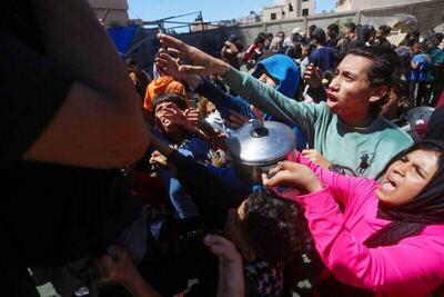  لندن، قاتل گرسنگان فلسطینی در صف غذا