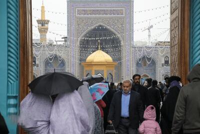  تصاویر زیبا از بارش باران بر گنبد طلایی امام رضا(ع)