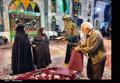  تجلیل از مادران شهدا در مجلس تعزیه شهادت حضرت عباس(ع) - تسنیم