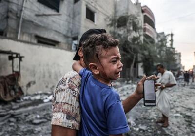 ببینید/وضعیت کودکان غزه‌ای در محل دفن زباله‌ها در جستجوی غذا و وسیله‌ای برای گرم کردن - تسنیم