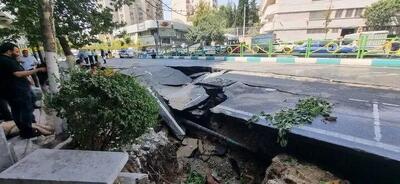 فرونشست زمین در تهران خودروها را بلعید!+عکس