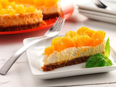  طرز تهیه کیک نارنگی یخچالی با فر | تمام فوت‌وفن‌های کیک پنیر میوه‌ای