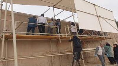  مرمت کتیبه سه زبانه داریوش + فیلم