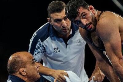 حضور همزمان احسان امینی در کشتی آزاد جوانان و بزرگسالان