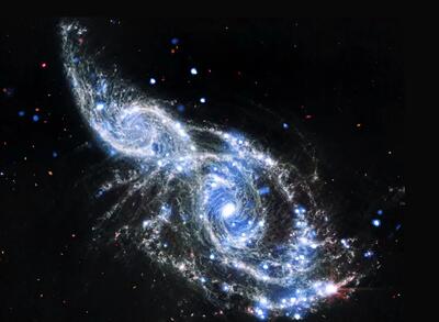 عکسی خیره کننده از برخورد کهکشان ها با یکدیگر