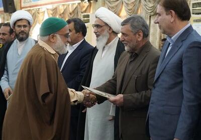 تجلیل از خانواده شهدا در تجمع 9 دی بوشهر - تسنیم