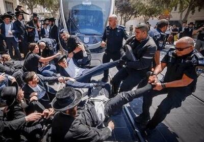 درگیری حریدی‌ها با پلیس رژیم صهیونیستی در خیابان‌های قدس - تسنیم