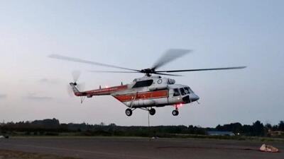  تأمین اقلام اساسی روستاهای محصور در برف الیگودرز با بالگرد هلال‌احمر