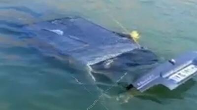  تصاویر سقوط مرگبار خودرو به داخل سد مهاباد